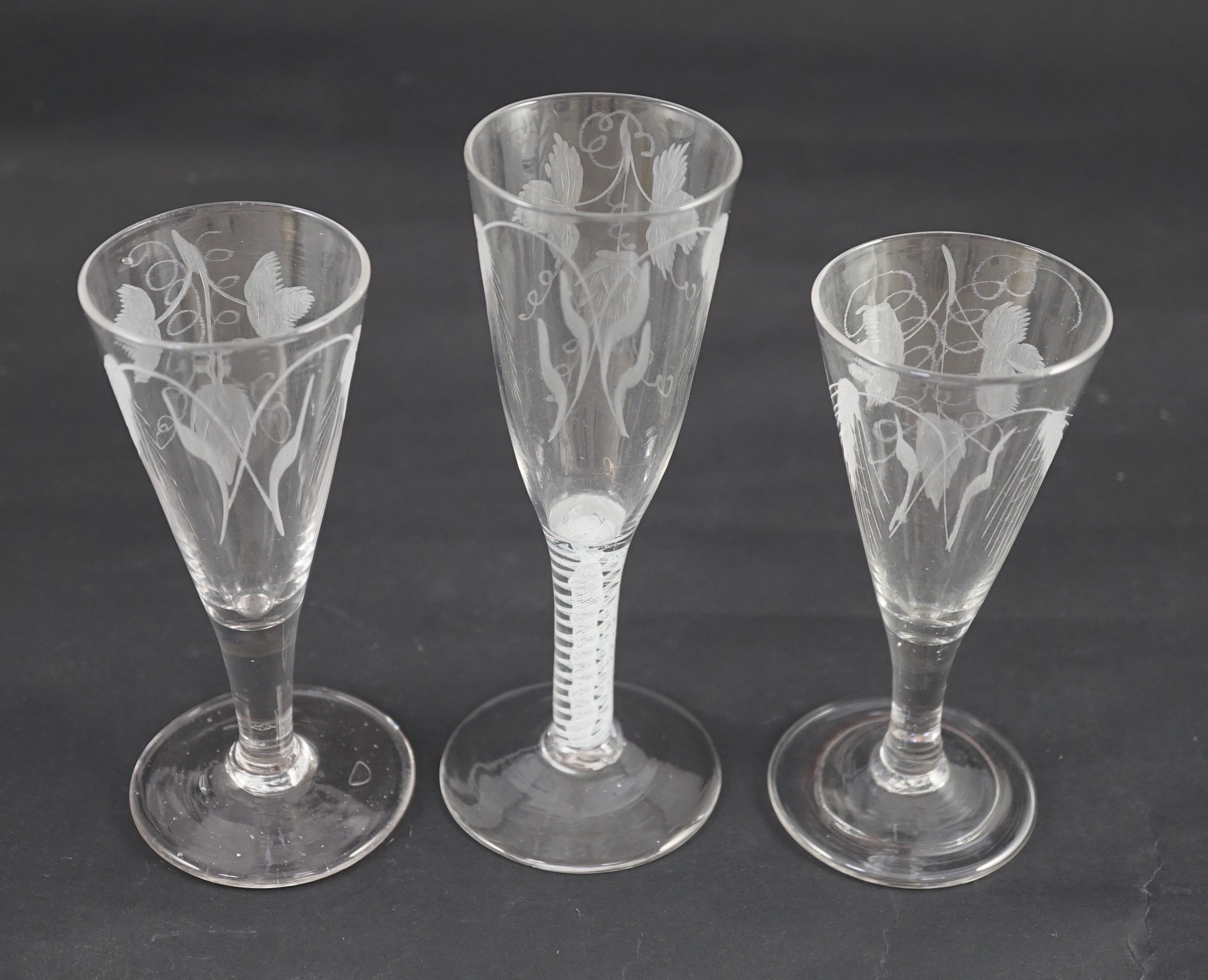 Three ‘hops and barley’ wheel engraved glass ale flutes, mid 18th century